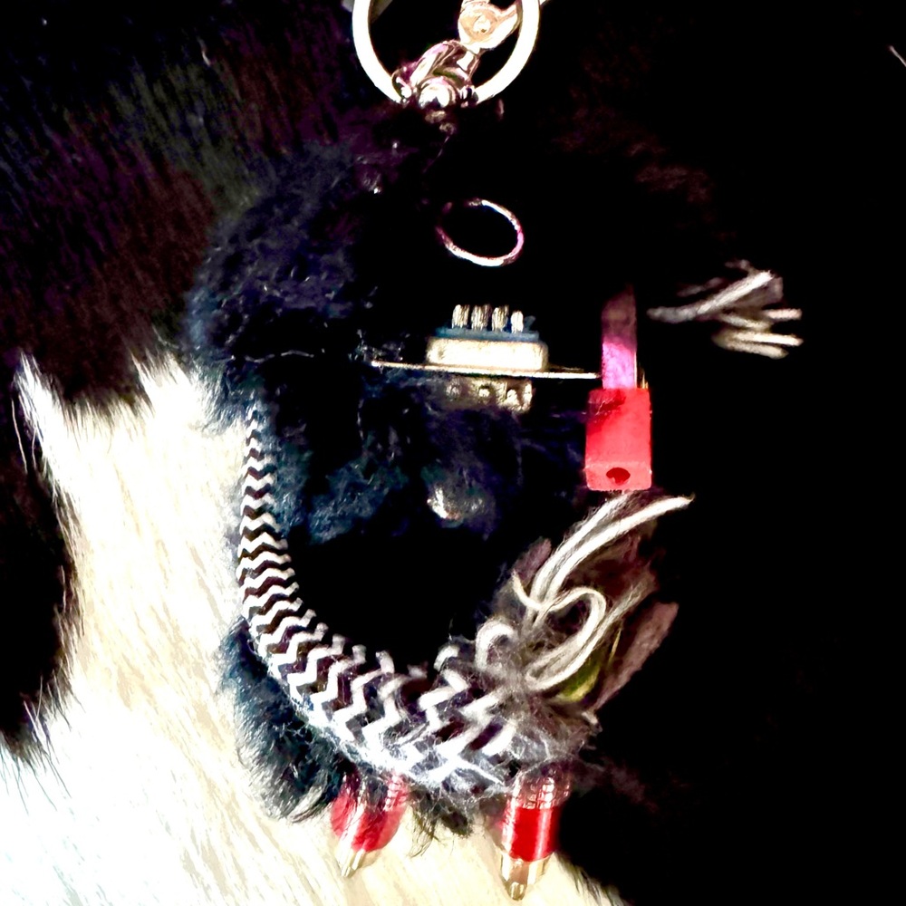 Prada Black & Red Fur Charm with Metallic Red Accents